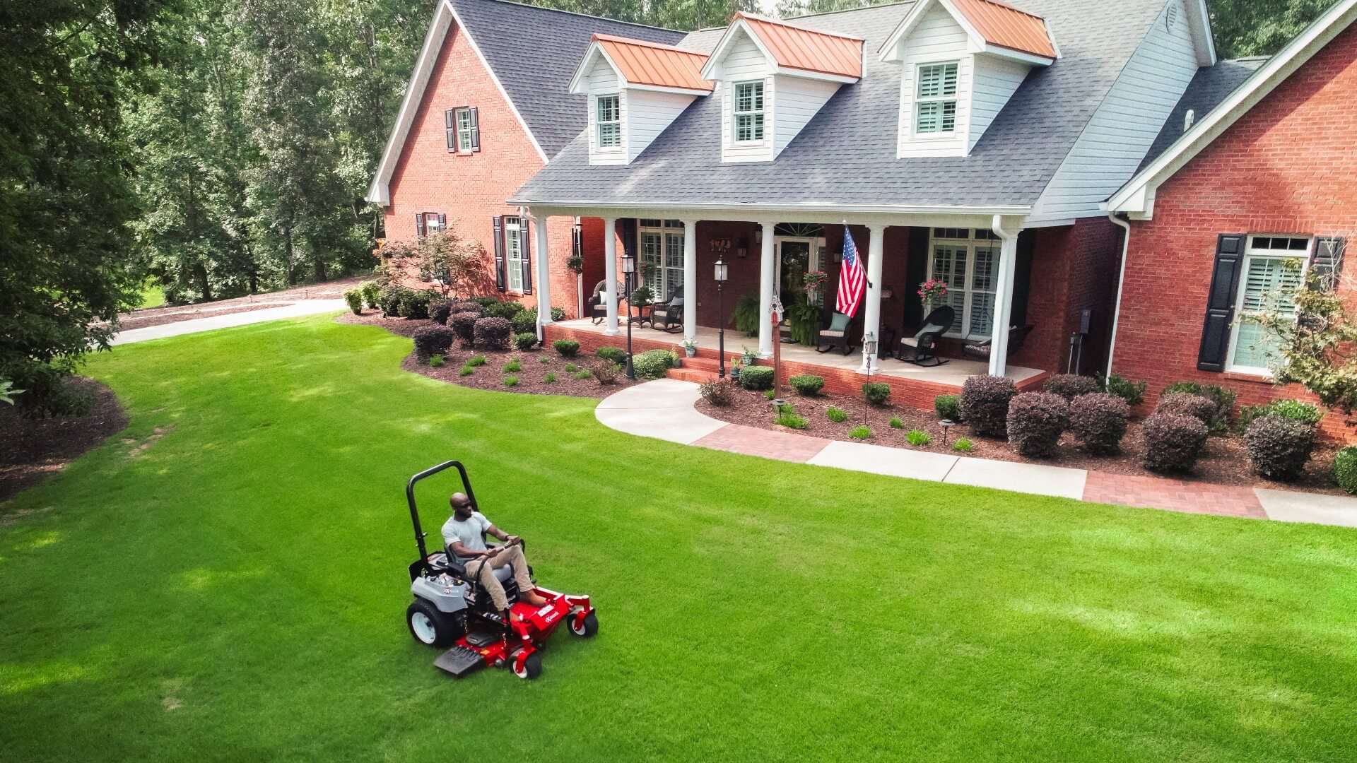 Professional lawn mower on green lawn